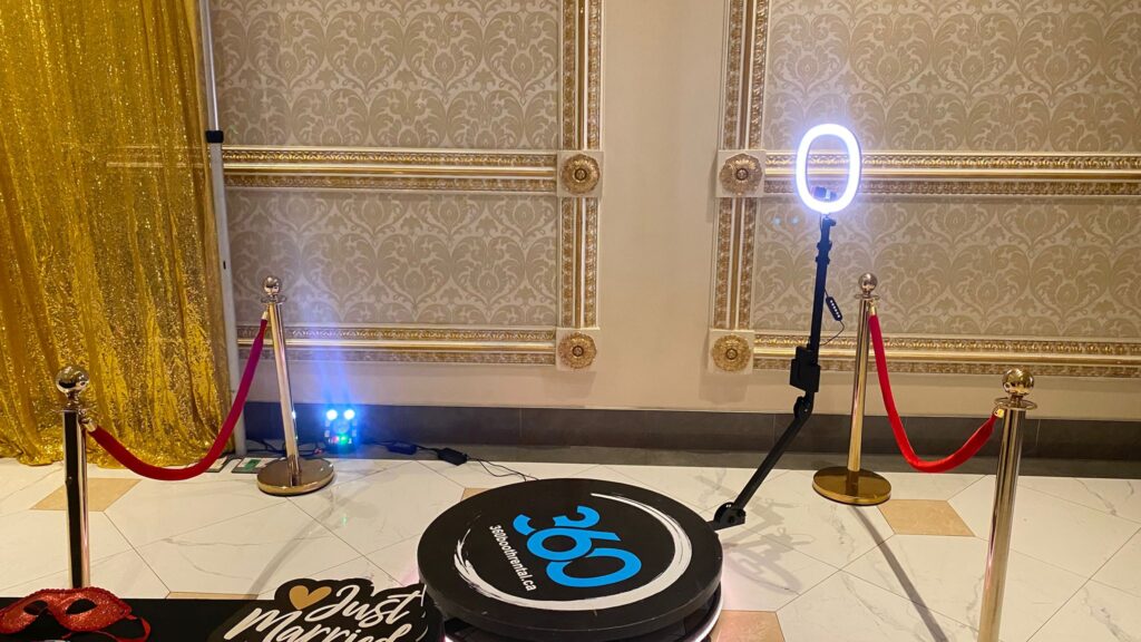 360 video booth with props and a backdrop