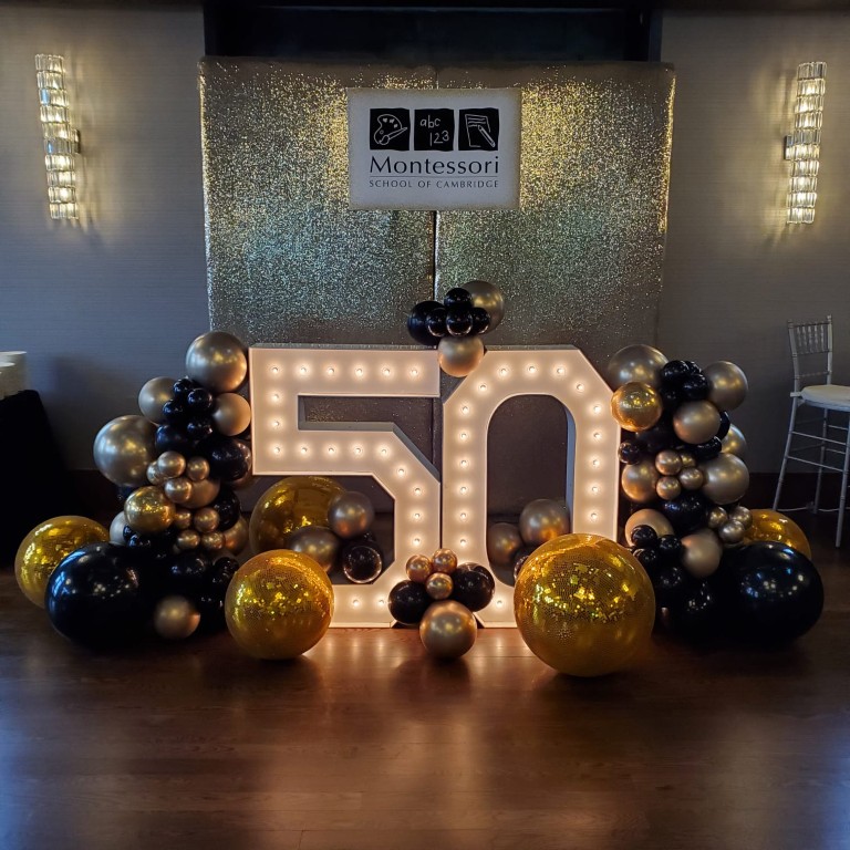 marquee numbers, balloon decor and backdrop for a corporate event