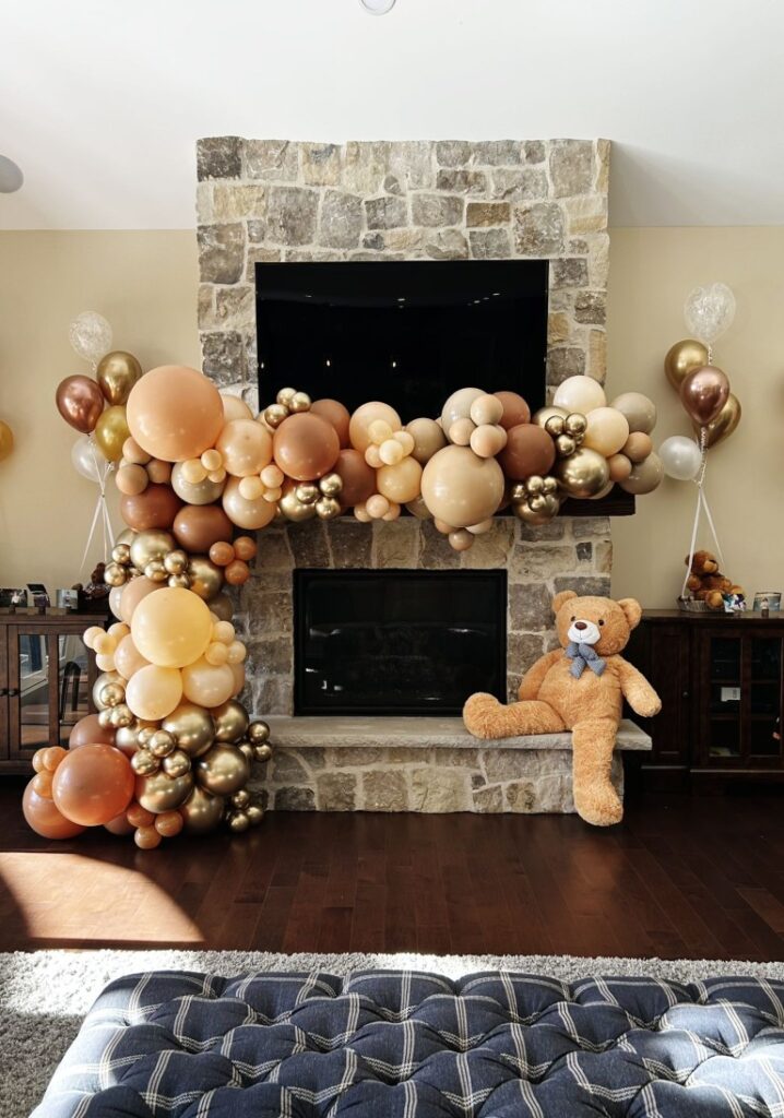 balloon decor and a stuffed animal