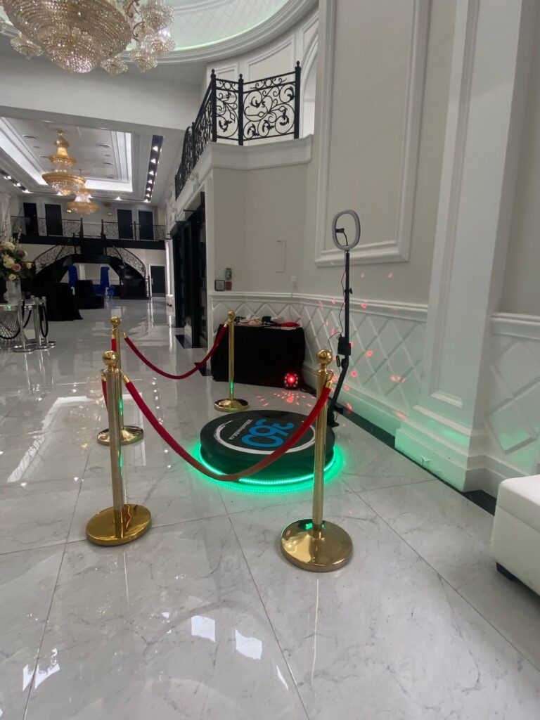 360 video booth with props and stanchions