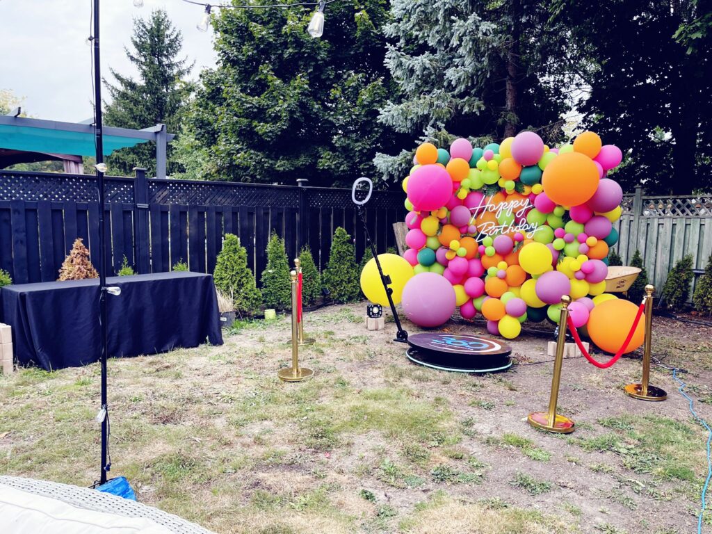 balloon wall, 360 video booth and stanchions